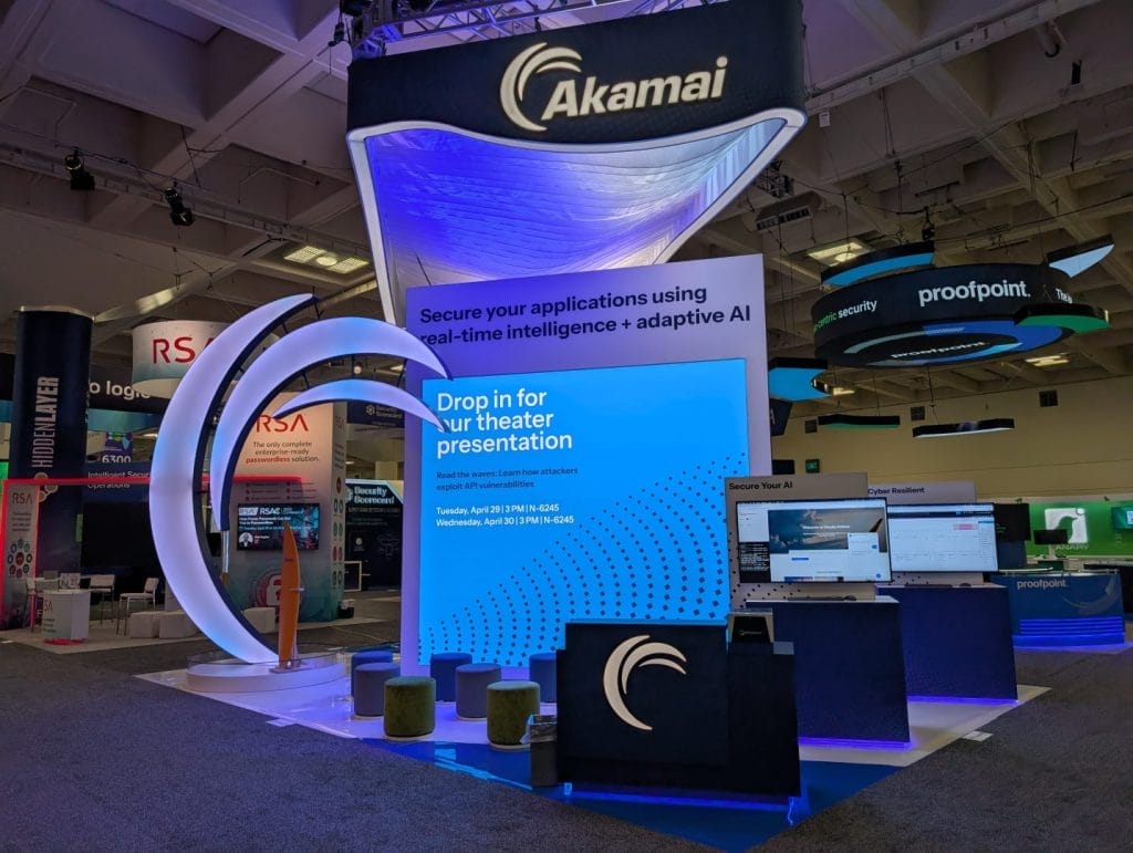 Akamai event booth with curved LED arch display.